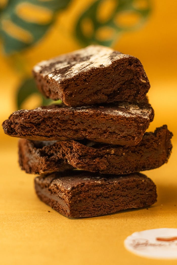 Stack of rich chocolate brownies with a focus on texture, perfect for dessert inspiration.
